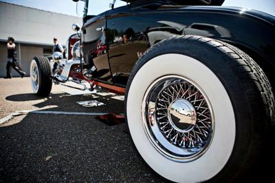 wheel of a black antique car